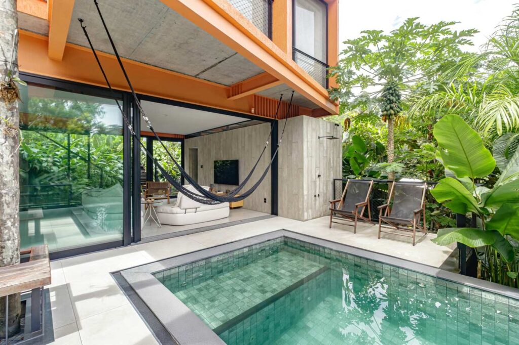 Modern house with a pool and outdoor lounging.-Phuket Thailand