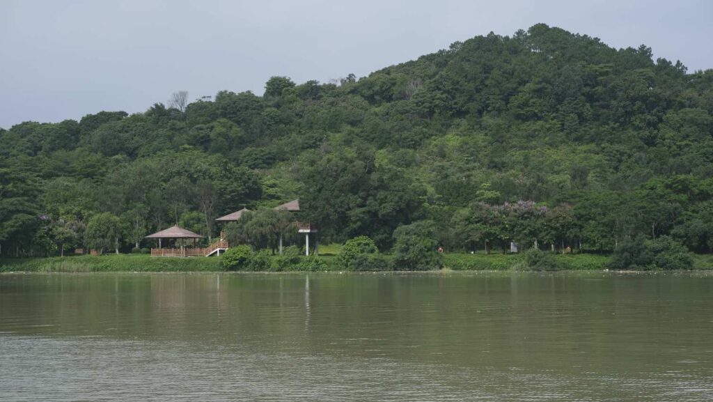 A lake with a lush, green mountain backdrop.-Koh Yao Yai Thailand