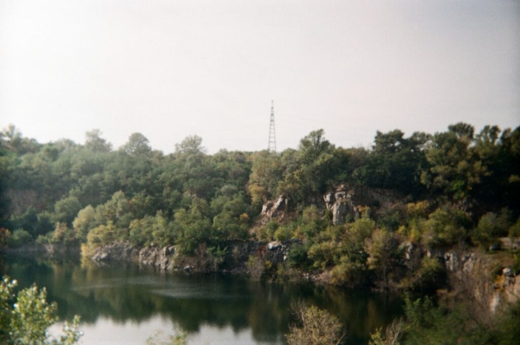 Trees and lake with a tall tower in the distance.-Nilaveli Sri Lanka