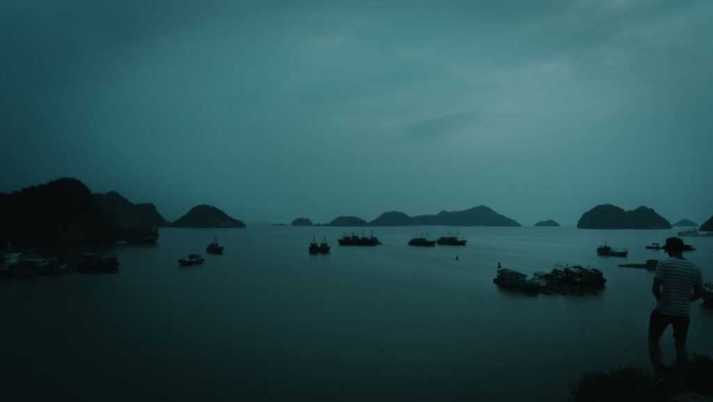 Boats on a body of water at dusk.-Pulau Pom Pom malaysia