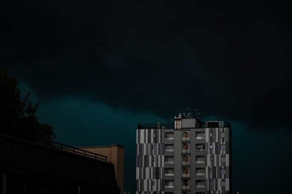 Dark storm clouds loom over a building.-Singapore weather