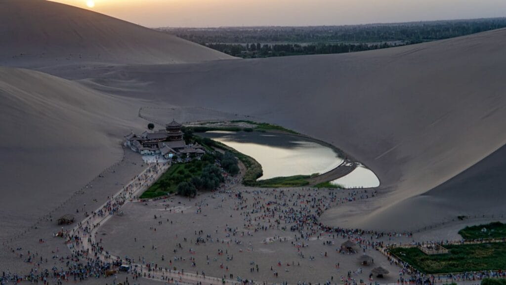 Desert oasis with crescent-shaped lake and sand dunes-Ras Al Khaimah United Arab Emirates