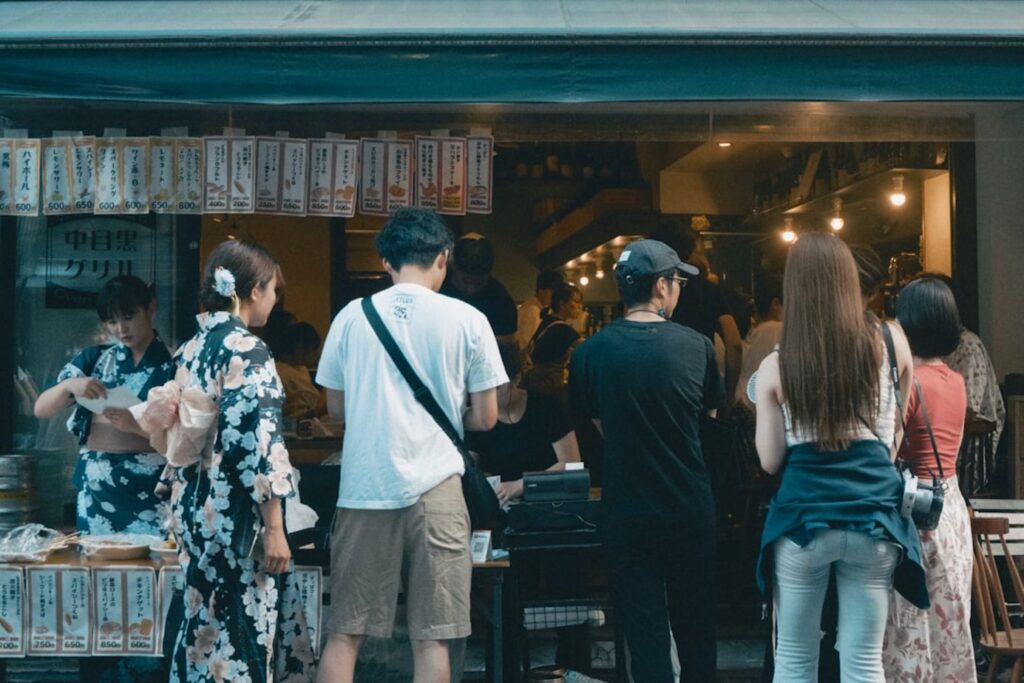 People gather at a japanese shop.-Singapore clothing