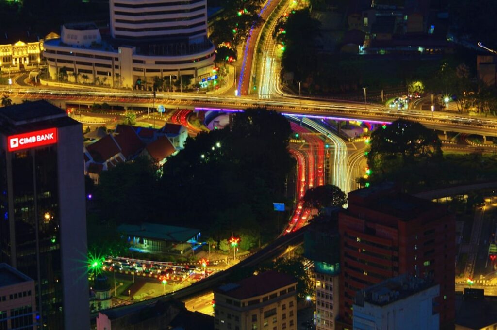 Cityscape at night with illuminated buildings and roads-Bangkok road