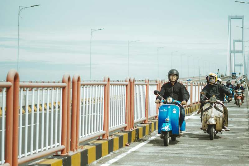 Friends Riding Vintage Scooters on Suramadu Bridge