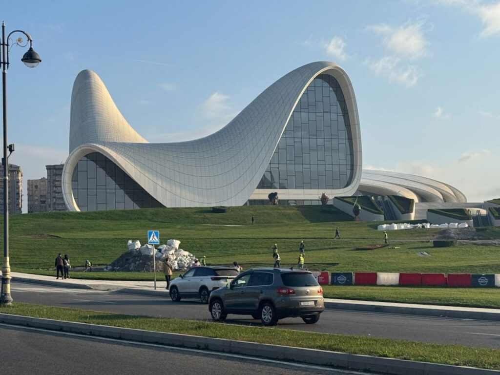 Modern white building with curved architecture on grassy hill-lankaran Azerbaijan