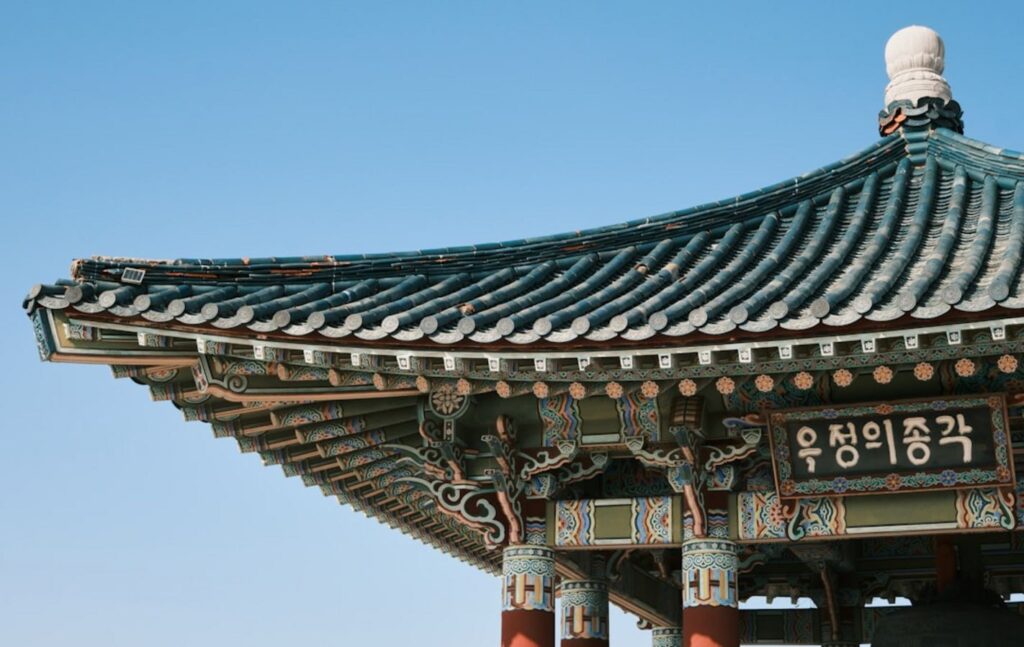 Traditional korean pavilion roof against a clear blue sky-south korea temple