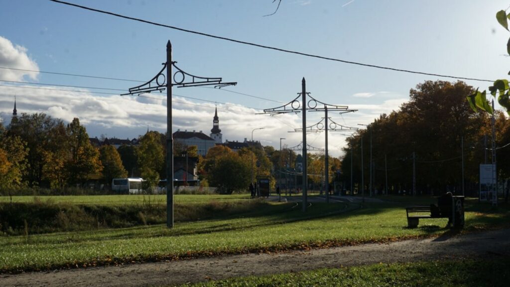 Tall towers with wires in a park setting.-sapporo Japan